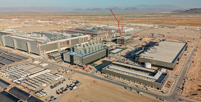 A large commercial facility being built in the desert.
