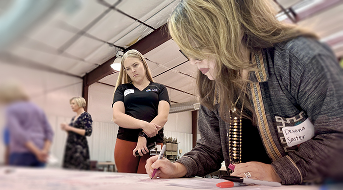 DeVona Saiter adds to a shared timeline of La Paz Countyâs water history. Photo by Faith Kearns.