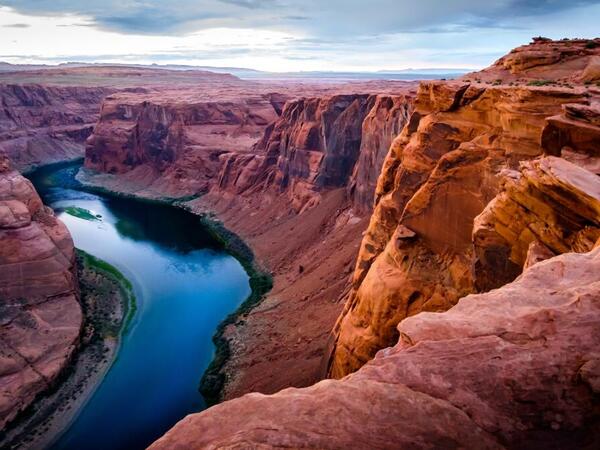 A river winds through dramatic redrock canyon