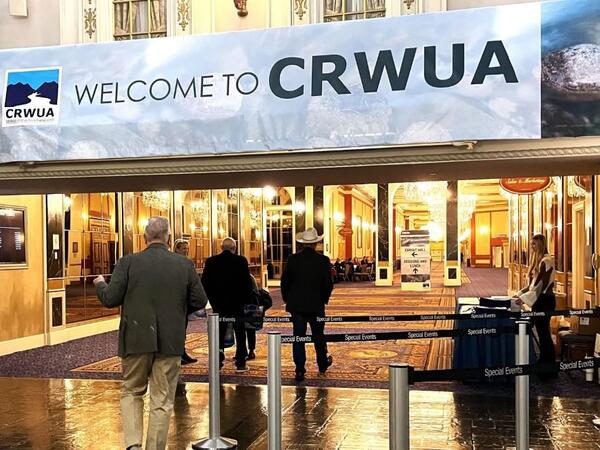 Banner in conference hall with Welcome to CRWUA posted