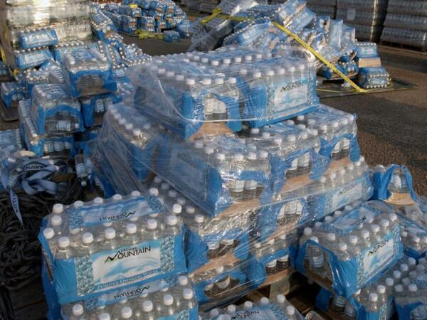 Crates of bottled water for distribution