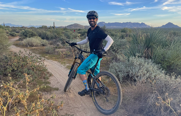 A man on a mountain bike in a desert landscape