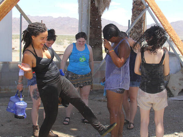 a group of students under a water spout