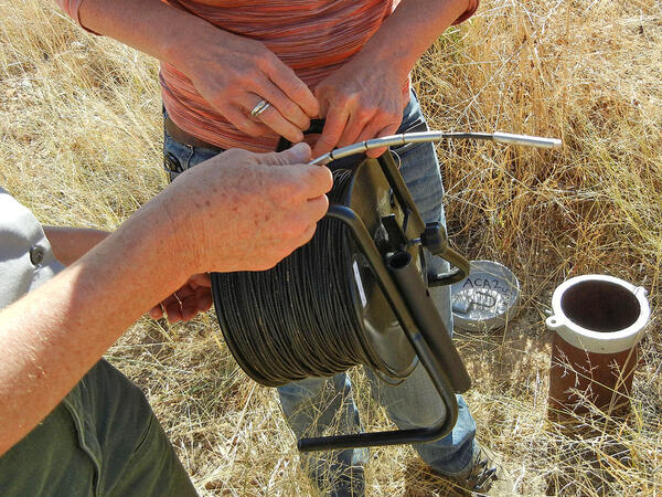 People monitoring a well