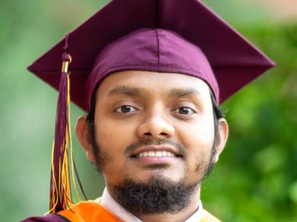 Man wearing ASU doctoral graduation gear