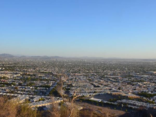 A sprawling desert city from above.