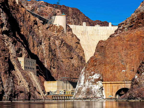A large dam in a desert canyon.