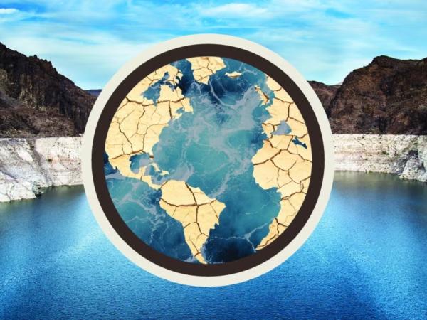 A cracked mud earth shape on a Lake Mead backdrop.
